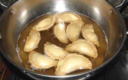 Gujiya dipped in Sugar Syrup – Gujhiya Recipe - Nishamadhulika.com